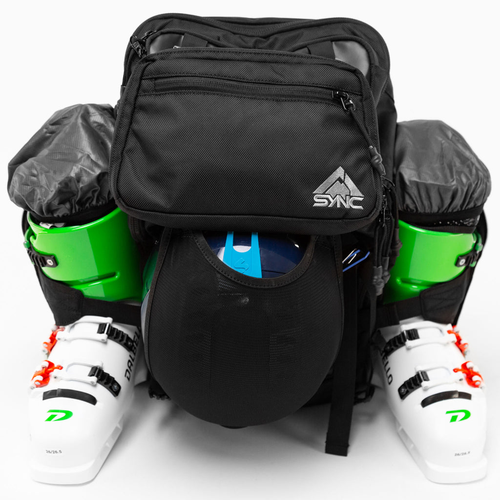 sync-performance-athlete-ski-race-backpack-boots-helmet-front